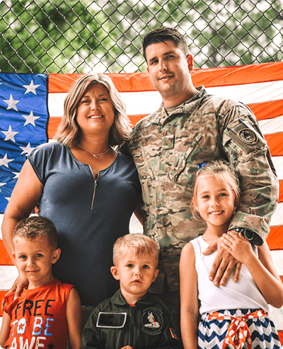 Family with USA flag & active duty military husband